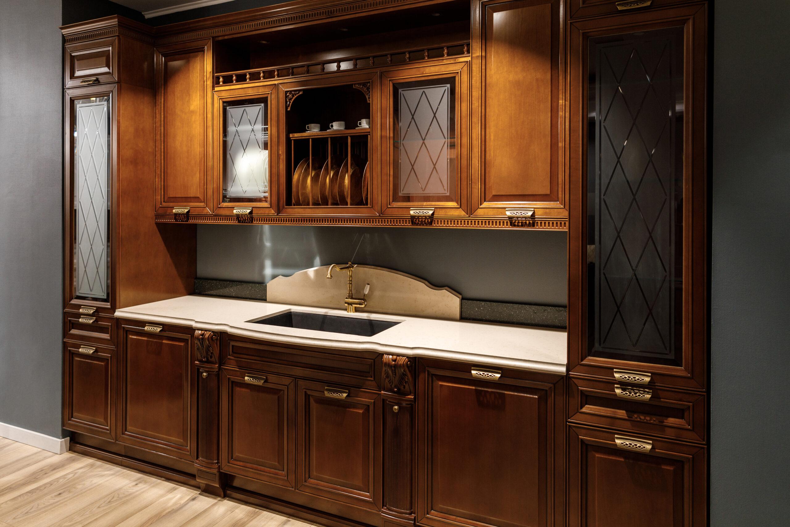 Renovated kitchen interior with wooden cabinets and sink